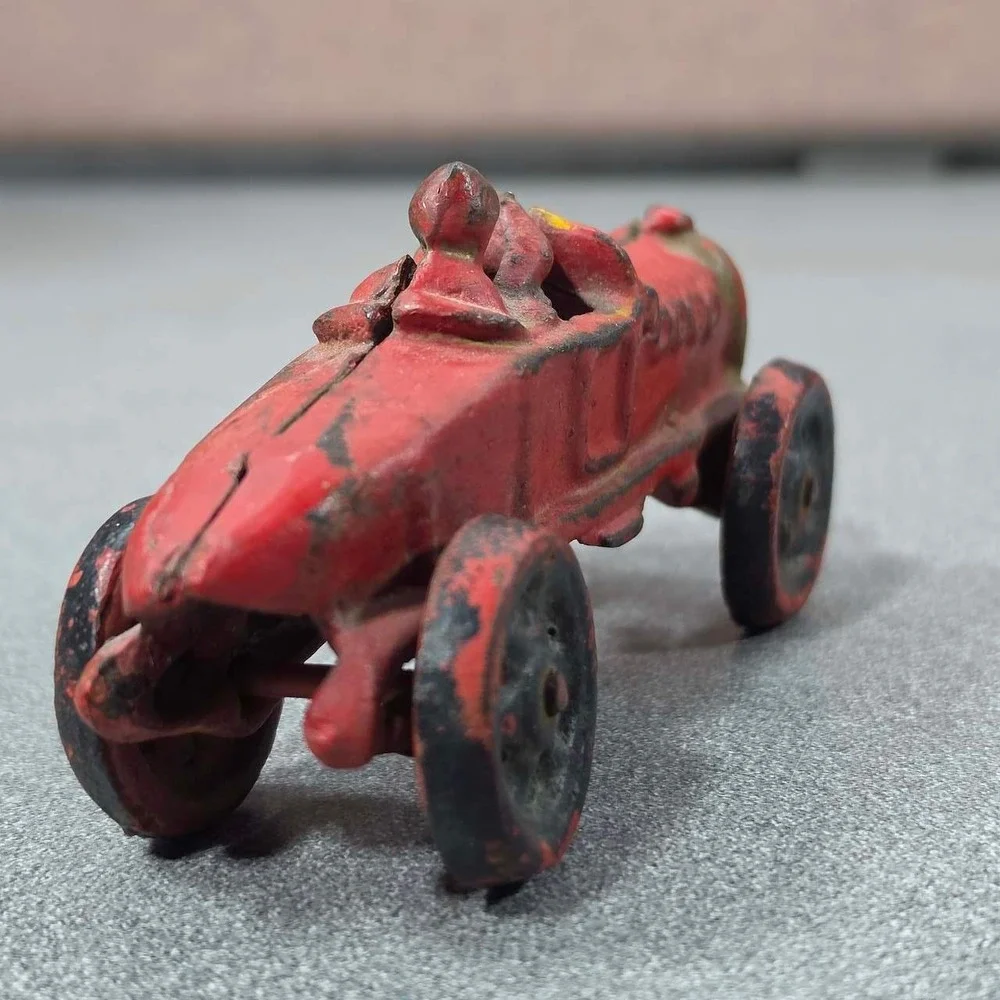 Antique Hubley Cast Iron Boat-tail Race Car Toy Driver 1920's.